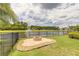 Beautiful firepit area near lakefront with fountain creates a serene backyard escape at 254 Cappella Ct, New Smyrna Beach, FL 32168