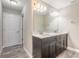 Bathroom features a double sink vanity with modern fixtures and a large mirror at 254 Cappella Ct, New Smyrna Beach, FL 32168