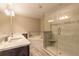 Bright bathroom featuring double vanity, soaking tub, and glass-enclosed shower at 254 Cappella Ct, New Smyrna Beach, FL 32168