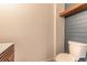 Modern half-bath with blue shiplap accent wall, open shelf, and a stylish toilet at 254 Cappella Ct, New Smyrna Beach, FL 32168