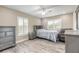 Cozy bedroom with wood floors, plantation shutters, and neutral paint at 254 Cappella Ct, New Smyrna Beach, FL 32168
