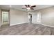 Bedroom with wood-look floors, neutral walls, and a sliding glass door to a patio, seamlessly blending indoor-outdoor living at 254 Cappella Ct, New Smyrna Beach, FL 32168