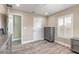 Bright bedroom with wood flooring, plantation shutters, and ensuite access at 254 Cappella Ct, New Smyrna Beach, FL 32168