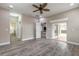Bedroom with wood-look floors, neutral walls, and a sliding glass door to a patio, seamlessly blending indoor-outdoor living at 254 Cappella Ct, New Smyrna Beach, FL 32168