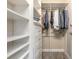 Walk-in closet with custom shelving and storage, providing ample space for organization at 254 Cappella Ct, New Smyrna Beach, FL 32168