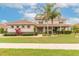 Charming two-story home with well-maintained landscaping and beautiful terracotta tiled roof at 254 Cappella Ct, New Smyrna Beach, FL 32168