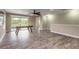 Open concept game room with an air hockey table and access to the outdoor balcony at 254 Cappella Ct, New Smyrna Beach, FL 32168