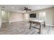 Large game room with hardwood flooring, ceiling fan, recessed lights, and a TV at 254 Cappella Ct, New Smyrna Beach, FL 32168