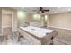 Large game room with hardwood flooring, ceiling fan, recessed lights, and an air hockey table at 254 Cappella Ct, New Smyrna Beach, FL 32168