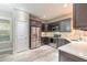 Modern kitchen with stainless steel appliances, white countertops, and wood-look floors at 254 Cappella Ct, New Smyrna Beach, FL 32168