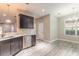 Modern kitchen with stainless steel appliances, white countertops, and wood-look floors at 254 Cappella Ct, New Smyrna Beach, FL 32168