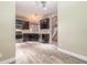 Modern kitchen with stainless steel appliances, white countertops, and wood-look floors at 254 Cappella Ct, New Smyrna Beach, FL 32168