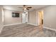 Large main bedroom with plank floors and natural light, showcasing an entertainment area at 254 Cappella Ct, New Smyrna Beach, FL 32168