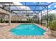 Beautiful screened in pool with paver deck and landscaping, perfect for relaxing at 254 Cappella Ct, New Smyrna Beach, FL 32168