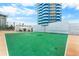 Outdoor basketball court with ocean view, surrounded by landscaping and modern condominium at 2625 S Atlantic Ave # 18Nw, Daytona Beach, FL 32118