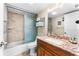 Bathroom featuring a vanity, toilet, and a shower with glass doors at 2625 S Atlantic Ave # 18Nw, Daytona Beach, FL 32118