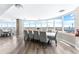 Elegant dining area with ocean views from large windows, chandelier and modern furnishings at 2625 S Atlantic Ave # 18Nw, Daytona Beach, FL 32118