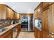 Well-equipped kitchen featuring stainless steel appliances, granite countertops, and custom cabinetry at 2625 S Atlantic Ave # 18Nw, Daytona Beach, FL 32118