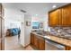 A well-lit kitchen featuring granite countertops and stainless steel appliances at 2625 S Atlantic Ave # 18Nw, Daytona Beach, FL 32118