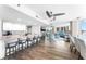 Bright and airy kitchen with bar seating area, white cabinets and open access to the living room at 2625 S Atlantic Ave # 18Nw, Daytona Beach, FL 32118