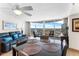 Open-concept living room with dining area featuring comfortable seating and access to a scenic balcony at 2625 S Atlantic Ave # 18Nw, Daytona Beach, FL 32118