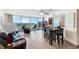 Inviting living space featuring tile flooring, comfortable seating, and balcony access with panoramic views at 2625 S Atlantic Ave # 18Nw, Daytona Beach, FL 32118