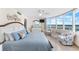 A bright main bedroom boasts waterfront views and coastal-themed decor at 2625 S Atlantic Ave # 18Nw, Daytona Beach, FL 32118