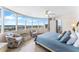 Main bedroom showcases waterfront views with charming chairs and balcony access at 2625 S Atlantic Ave # 18Nw, Daytona Beach, FL 32118