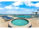 A luxurious pool and jacuzzi with ocean views from the on-site amenity deck at 2625 S Atlantic Ave # 18Nw, Daytona Beach, FL 32118
