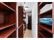 Custom walk-in closet featuring ample shelving and storage space at 2625 S Atlantic Ave # 18Nw, Daytona Beach, FL 32118