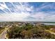 Breathtaking aerial view showcasing the community's coastal location and lush landscaping at 265 Minorca Beach Way # 902, New Smyrna Beach, FL 32169