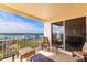 Condo balcony with furniture overlooking a beautiful waterway at 265 Minorca Beach Way, New Smyrna Beach, Florida at 265 Minorca Beach Way # 902, New Smyrna Beach, FL 32169