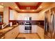 Spacious kitchen with stainless steel appliances, granite countertops and custom cabinets at 265 Minorca Beach Way # 902, New Smyrna Beach, FL 32169
