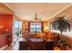 Open living space featuring a desk, leather sectional, and amazing water views at 265 Minorca Beach Way # 902, New Smyrna Beach, FL 32169