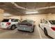 Well-lit parking garage featuring assigned parking spaces and bike racks for resident convenience at 265 Minorca Beach Way # 902, New Smyrna Beach, FL 32169