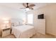 Cozy bedroom featuring neutral colors, a ceiling fan, and a chest of drawers with a TV at 2818 Taton Trce, New Smyrna Beach, FL 32168