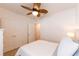 Bright bedroom featuring a ceiling fan, closet, and neutral-toned carpet at 2818 Taton Trce, New Smyrna Beach, FL 32168