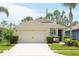 Charming single-story home with a well-manicured lawn, two-car garage, and a welcoming entrance at 2818 Taton Trce, New Smyrna Beach, FL 32168