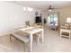 Open-concept dining and living area with a comfortable seating arrangement, and natural light at 2818 Taton Trce, New Smyrna Beach, FL 32168