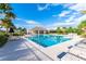 Resort-style pool with lounge chairs and a covered pavilion at 2818 Taton Trce, New Smyrna Beach, FL 32168