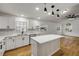 Bright kitchen featuring white cabinets, stainless steel appliances, and a center island at 2822 Brookline Ave, New Smyrna Beach, FL 32168