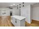Bright kitchen featuring white cabinets, stainless steel appliances, and a center island at 2822 Brookline Ave, New Smyrna Beach, FL 32168