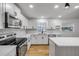 Bright kitchen featuring white cabinets, stainless steel appliances at 2822 Brookline Ave, New Smyrna Beach, FL 32168