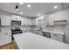 Bright kitchen featuring white cabinets, stainless steel appliances and a center island at 2822 Brookline Ave, New Smyrna Beach, FL 32168