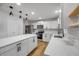 Modern kitchen featuring white cabinets, stainless steel appliances and a center island at 2822 Brookline Ave, New Smyrna Beach, FL 32168