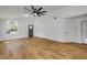 Bright living area featuring wood-look floors and a view of the front door at 2822 Brookline Ave, New Smyrna Beach, FL 32168