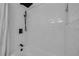 Bright shower features white subway tile and black fixtures at 2822 Brookline Ave, New Smyrna Beach, FL 32168