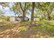 View of a backyard featuring outbuildings and a picnic table at 2917 Crockett Pt, Sanford, FL 32773