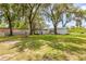 Wide backyard with trees, lawn, and a picnic table at 2917 Crockett Pt, Sanford, FL 32773