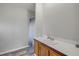 Bathroom featuring a vanity with a white sink, wooden cabinets, and a shower with blue accents at 2917 Crockett Pt, Sanford, FL 32773